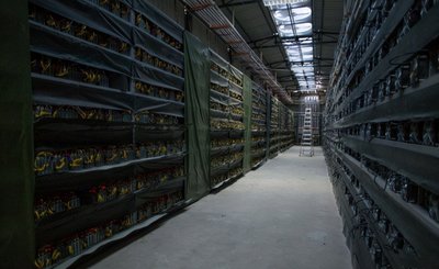 State-of-the-art cryptocurrency mining farm with rows of mining machines operating